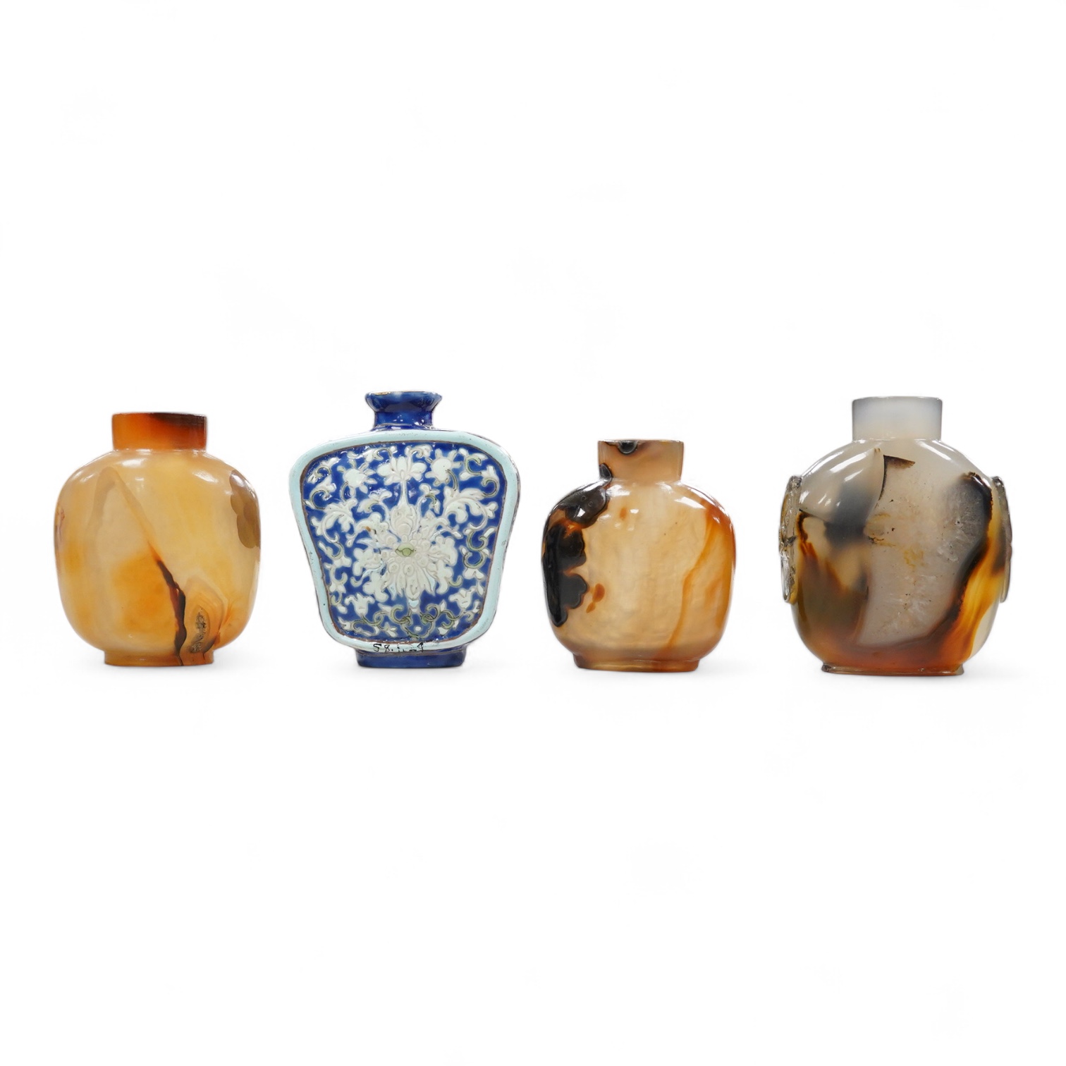 Three 19th century Chinese agate snuff bottles and a porcelain snuff bottle, largest 6cm high (4)